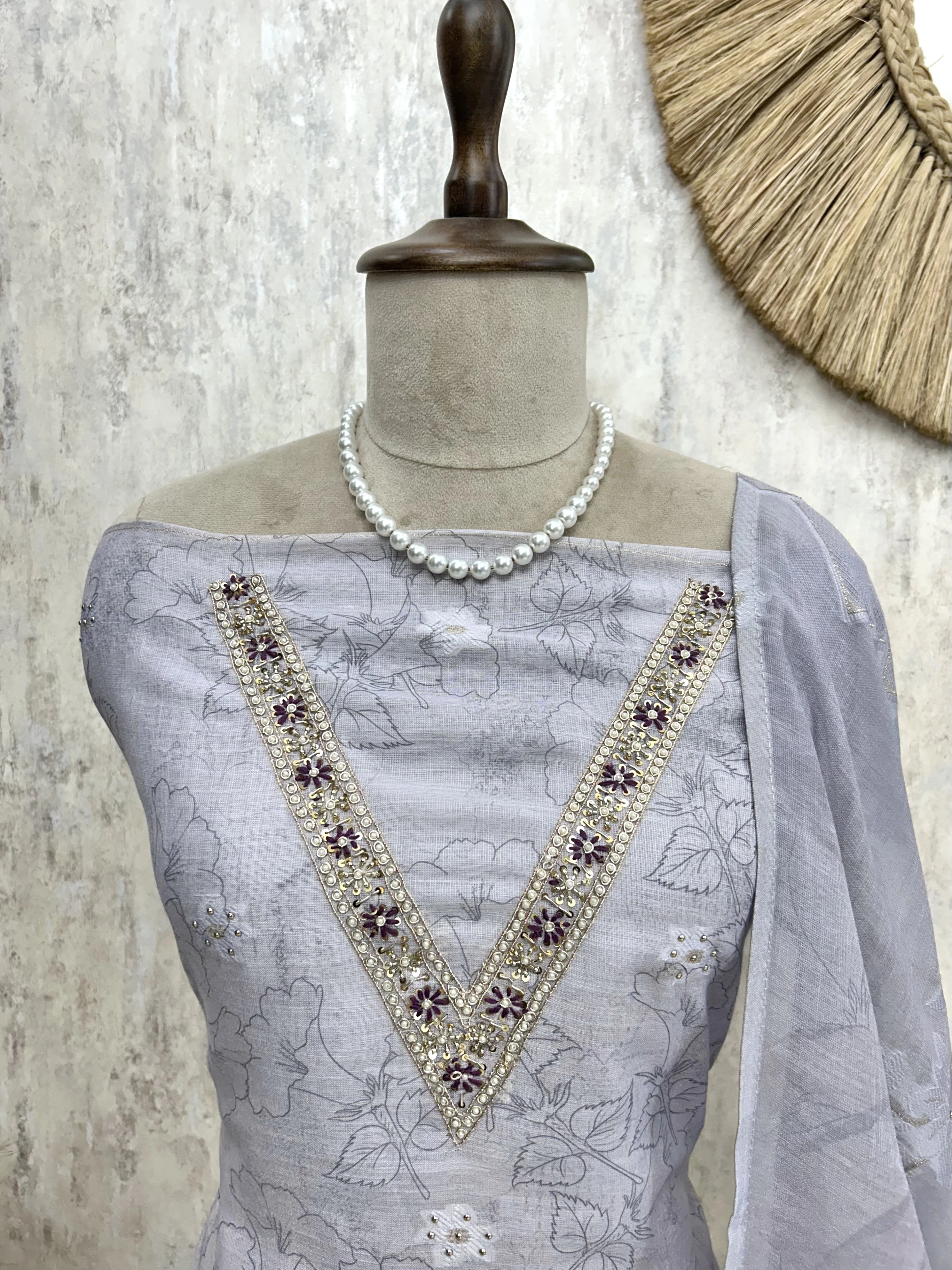 Linen Unstitched Suit Set With Embroidered Neckline & Woven Hemline