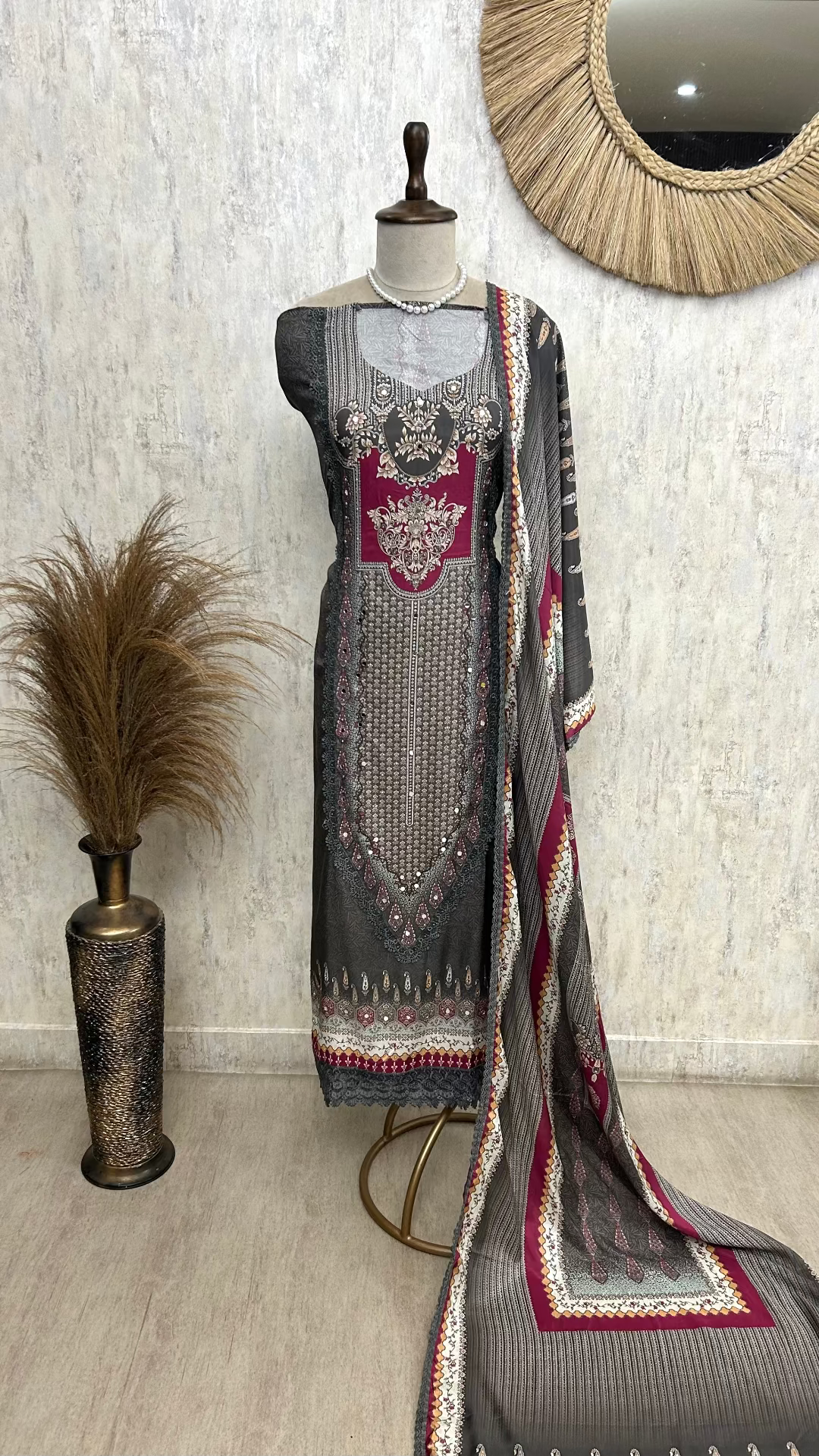 Traditional outfit on a mannequin with a decorative background